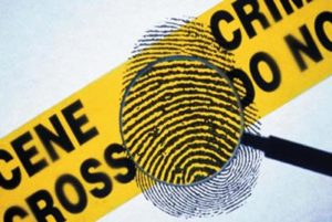 Picture of a magnifying glass and crime scene tape